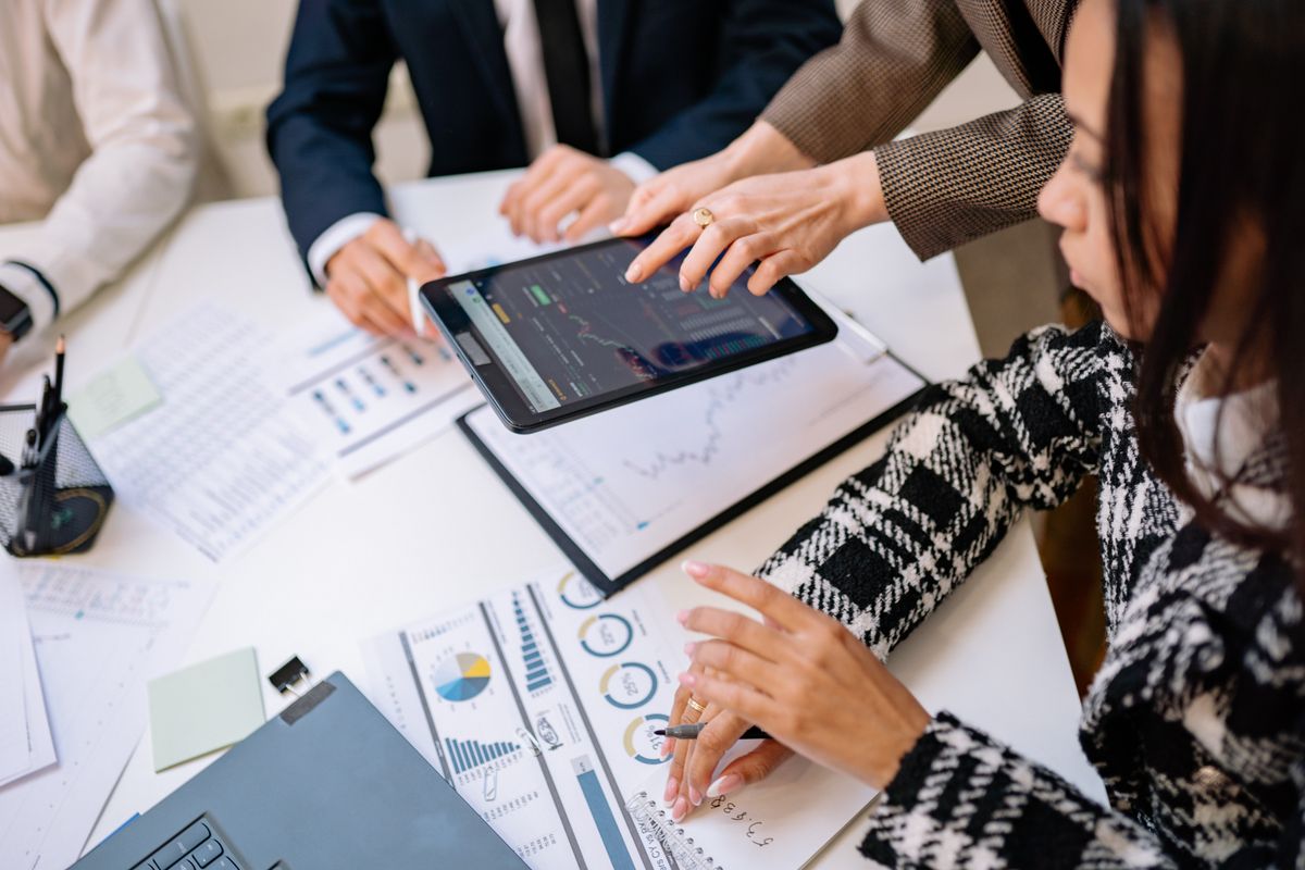Executive managers analyzing marketing statistics